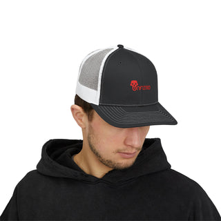 A men wears a black and white trucker hat with a red logo, paired with a black hoodie, standing against a plain background.