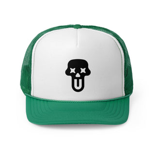 Green and white graphic trucker hat featuring a bold black skull UNFLTRD logo with star eyes and a tongue sticking out.