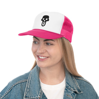 A woman wearing a denim jacket and a pink and white graphic trucker hat with a black UNFLTRD Logo
