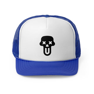 White trucker hat with a blue brim, featuring a black skull UNFLTRD logo with star eyes and a tongue sticking out at the center.