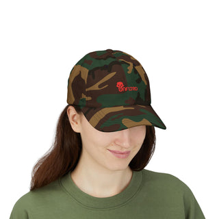 Woman wearing a graphic cap with a red UNFLTRD logo