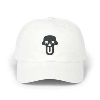 White baseball cap featuring a bold black UNFLTRD logo beneath it.