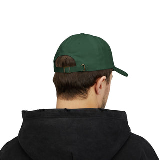 A young man with short hair wearing a dark hoodie and a green cap, viewed from behind, showcasing the cap's adjustable strap.