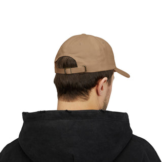 A young man wearing a beige graphic hat and a black graphic hoodie, seen from the back, with a casual and relaxed appearance.